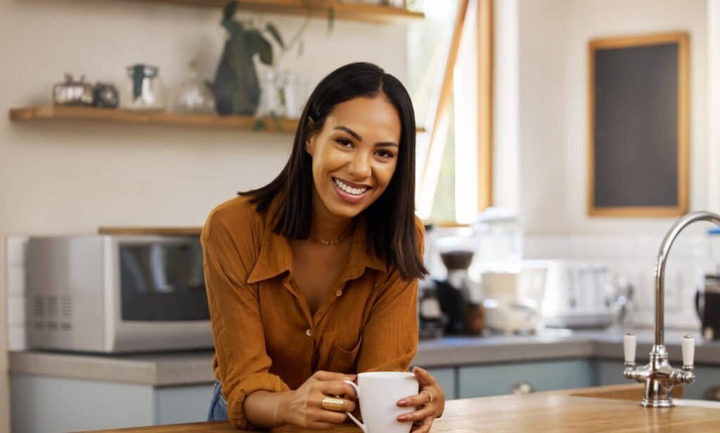 Happy,Portrait,,Coffee,And,Woman,At,House,In,A,Kitchen