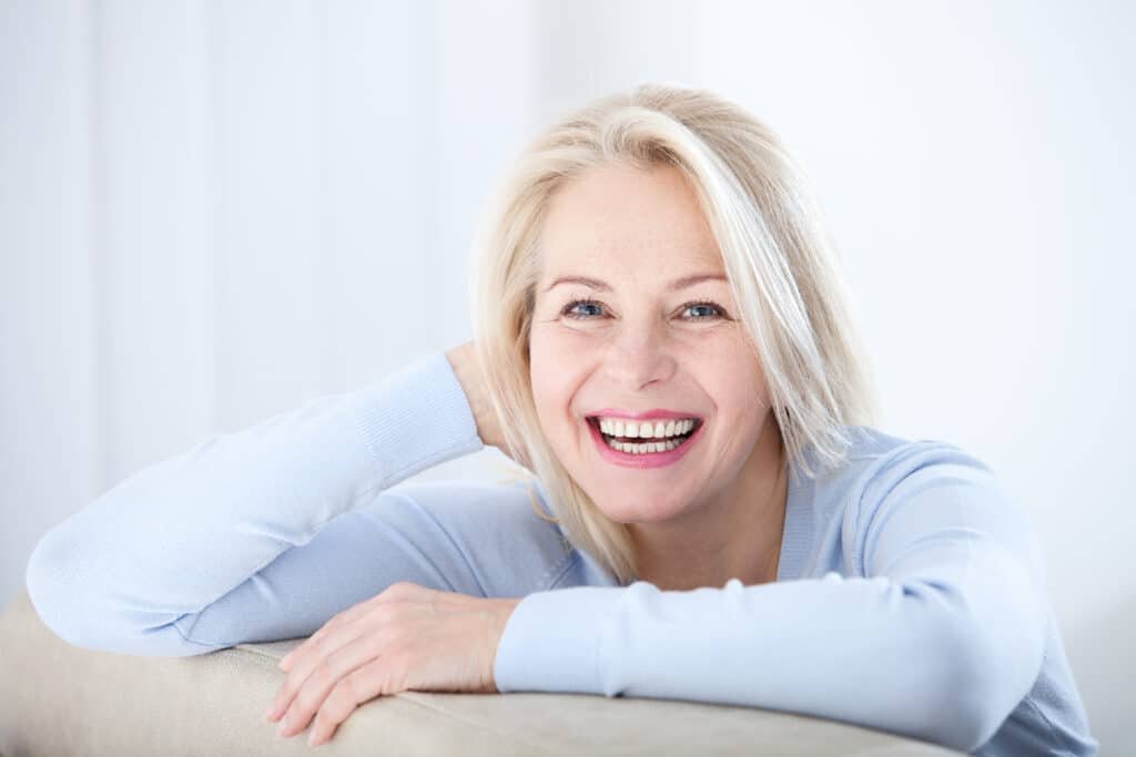Active,Beautiful,Middle-aged,Woman,Smiling,Friendly,And,Looking,In,Camera